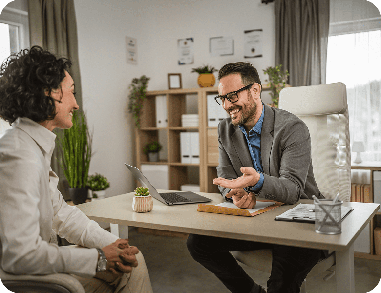 Two people having a pleasant office conversation.